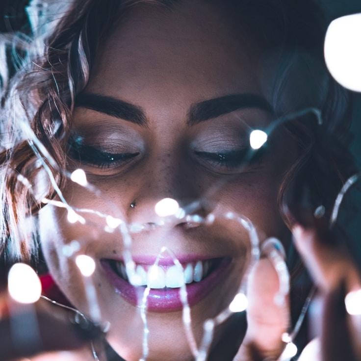 Kaveri Mehta, Lead Design Curator at Crisp Seed Store, reviewing corporate floral arrangements